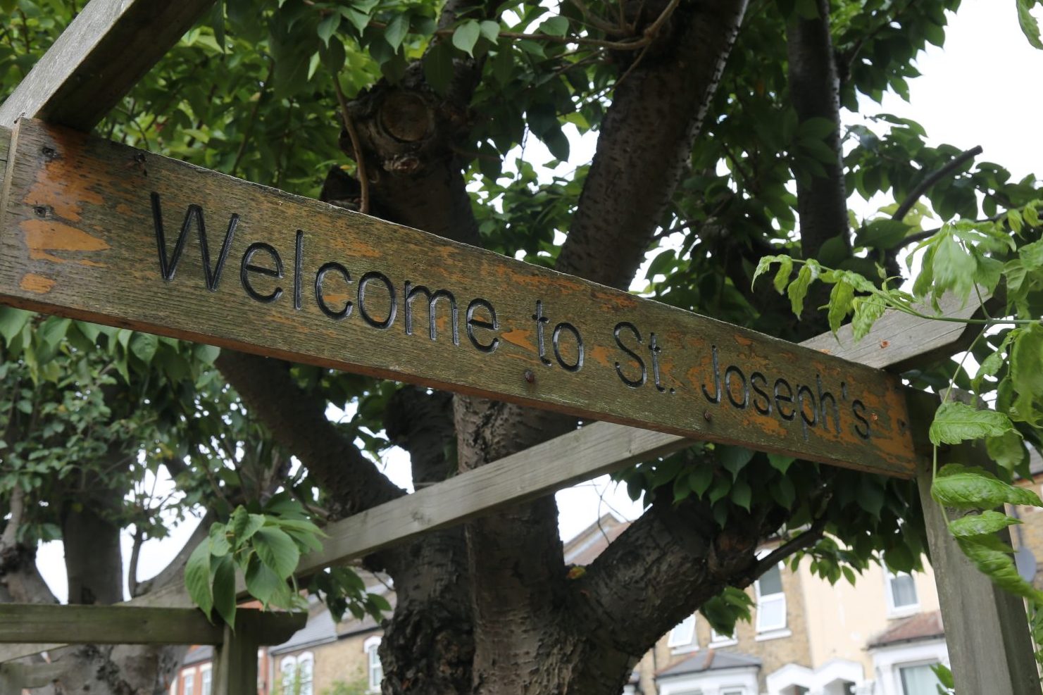 St Joseph's Catholic Church. Image of vintage sign post outside the Parish.